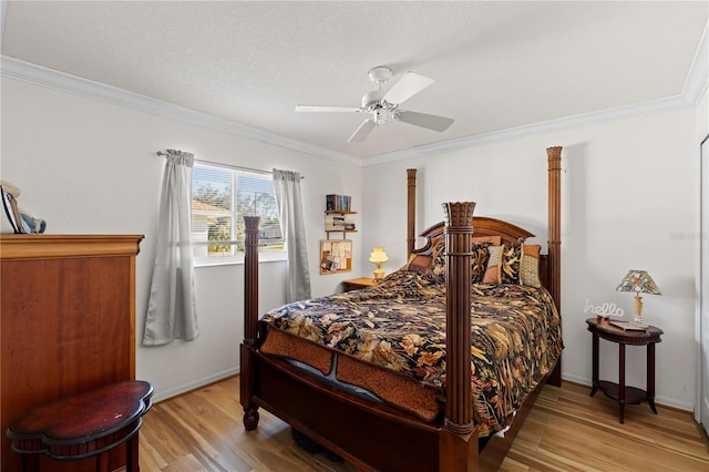 bedroom with ornamental molding, light wood-type flooring, and ceiling fan