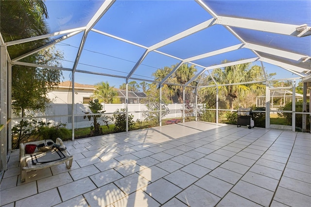 view of patio / terrace featuring glass enclosure