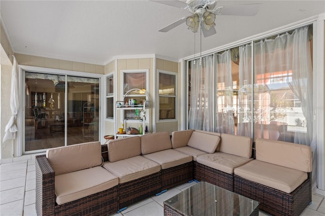 unfurnished sunroom featuring ceiling fan