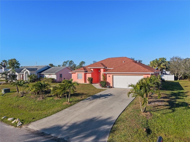 view of front of home featuring a garage and a front lawn