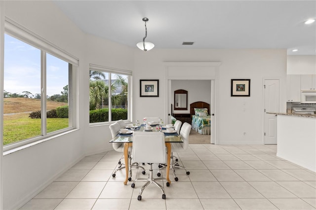 dining room with light tile patterned flooring