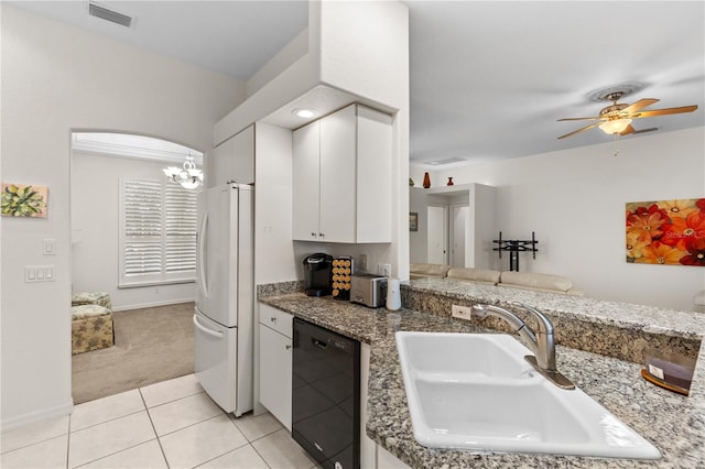 kitchen with white cabinetry, black dishwasher, sink, dark stone countertops, and white fridge