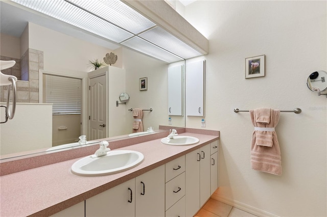 bathroom with tile patterned flooring and vanity