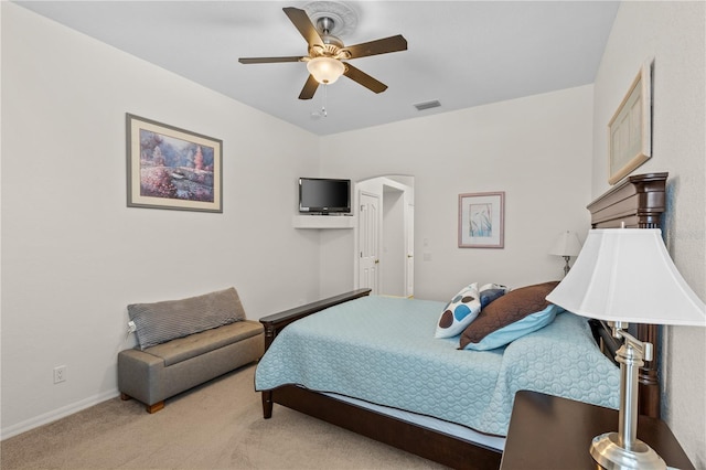 bedroom with ceiling fan and light colored carpet