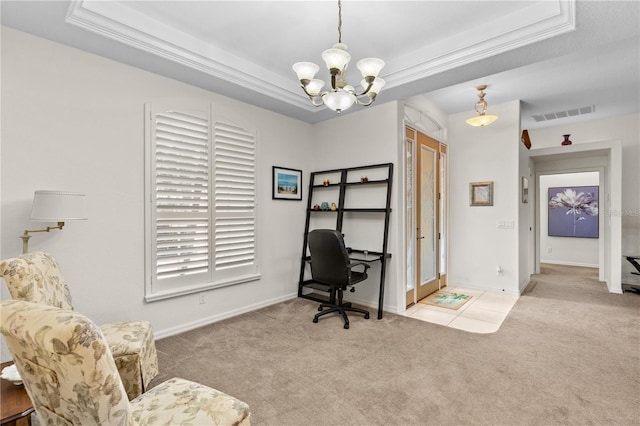 office space with an inviting chandelier, a tray ceiling, and light carpet