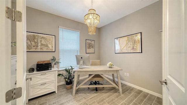 office area featuring an inviting chandelier