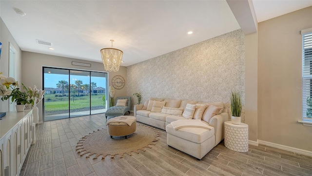 living room with an inviting chandelier