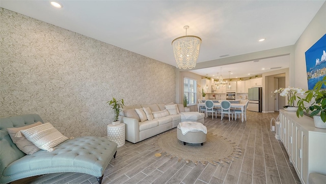 living room featuring an inviting chandelier