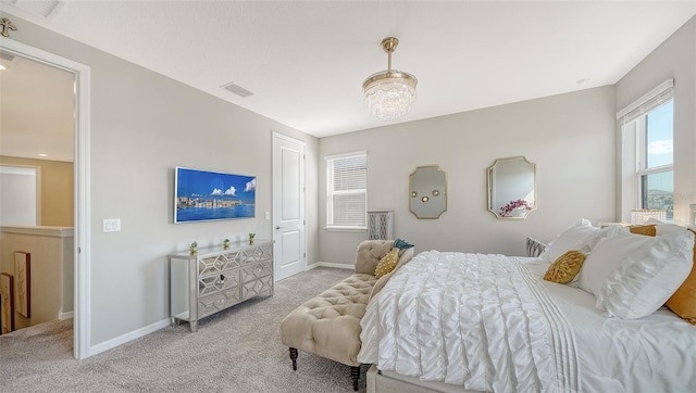 bedroom featuring light colored carpet