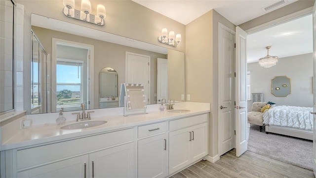 bathroom with vanity and hardwood / wood-style flooring