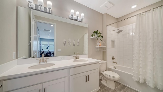 full bathroom with vanity, shower / bathtub combination with curtain, and toilet