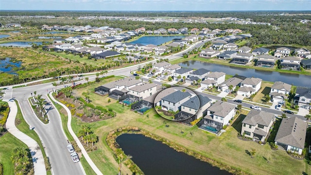 drone / aerial view with a water view