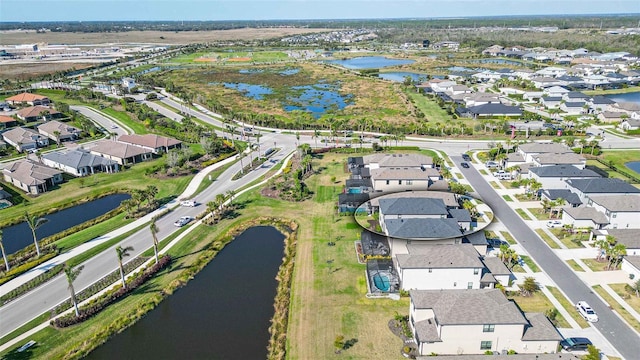 drone / aerial view with a water view