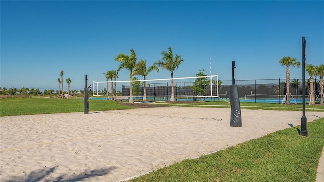 surrounding community with a yard and volleyball court