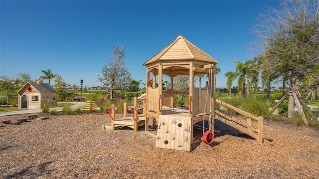 view of play area with an outdoor structure