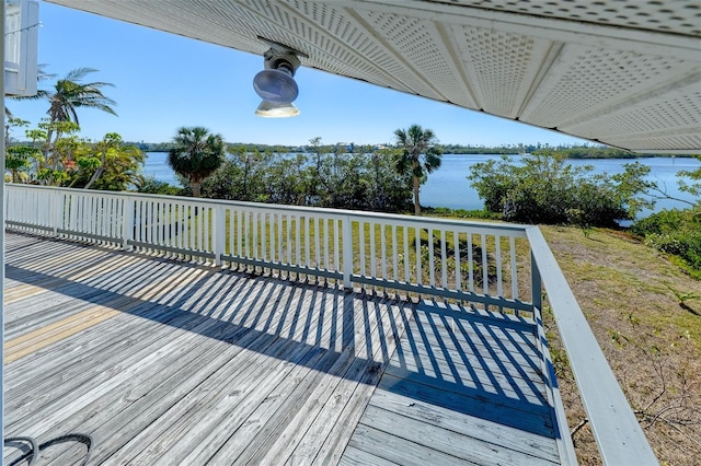 wooden deck with a water view