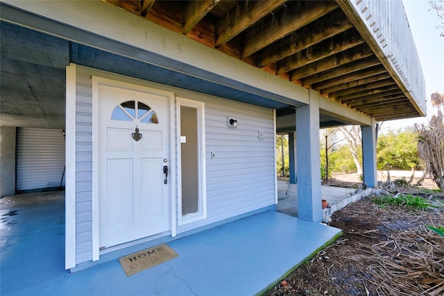 entrance to property featuring a patio area