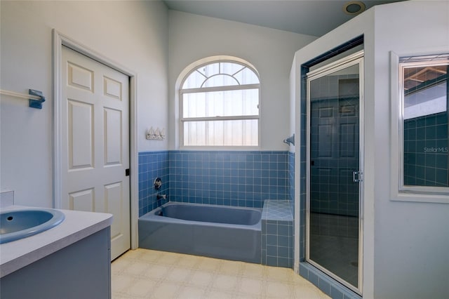 bathroom with vanity and plus walk in shower