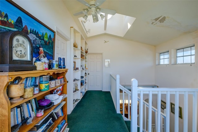 hallway featuring vaulted ceiling and dark colored carpet