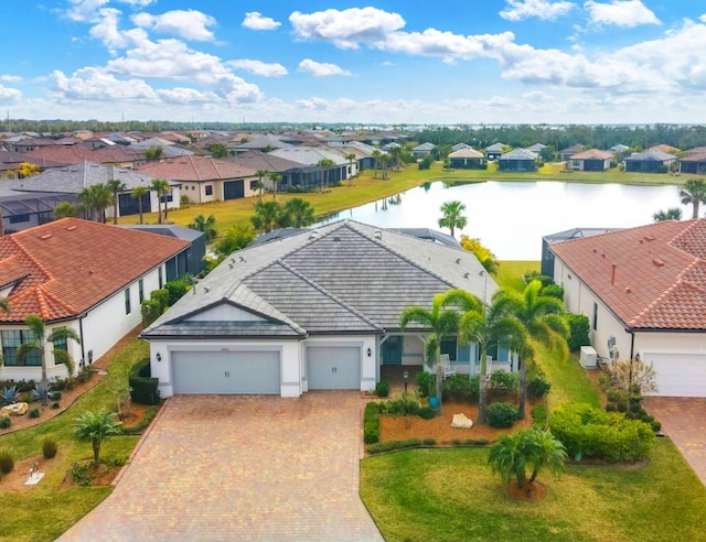 birds eye view of property with a water view