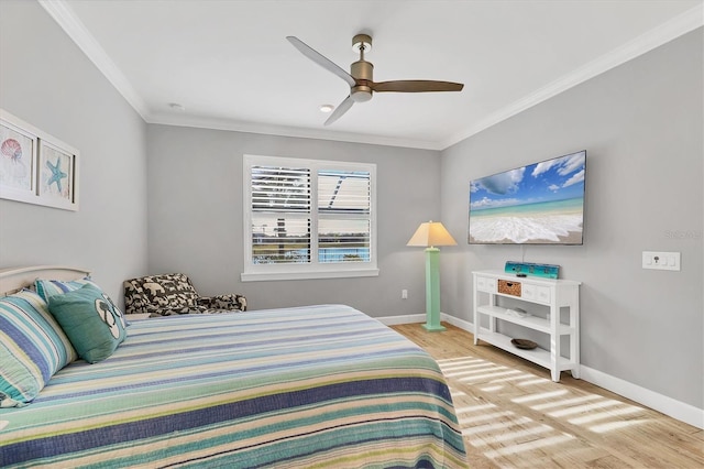 bedroom featuring crown molding, ceiling fan, and light wood-type flooring