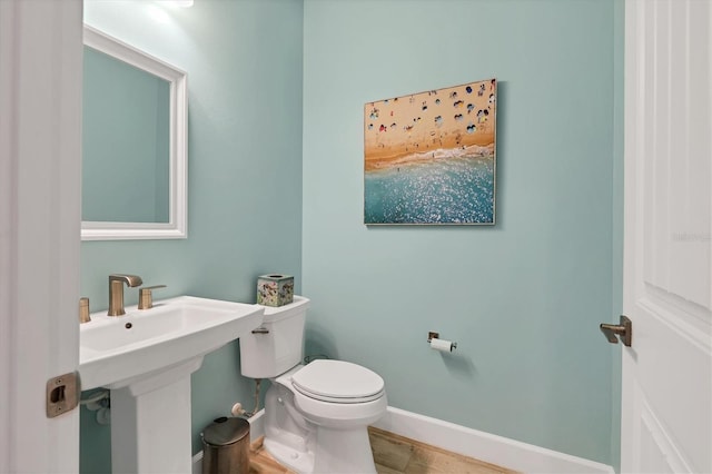 bathroom with sink and toilet