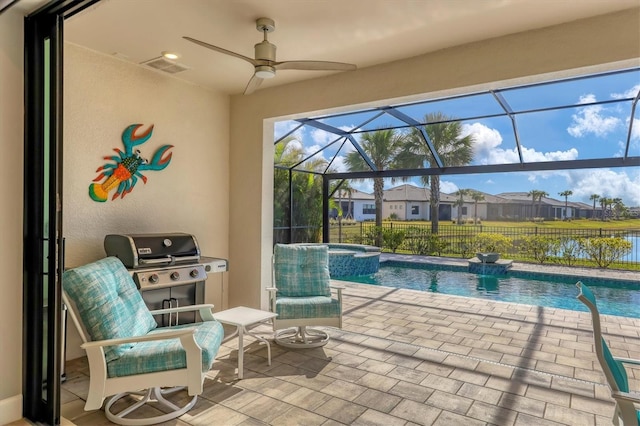 view of swimming pool featuring a patio, a grill, an in ground hot tub, glass enclosure, and a water view