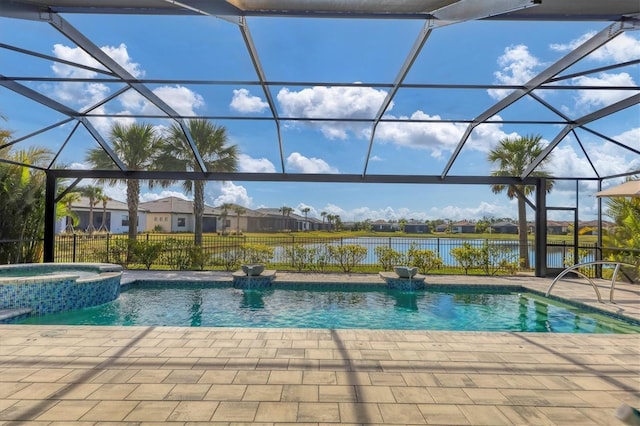 view of pool featuring a water view, an in ground hot tub, a lanai, and a patio area