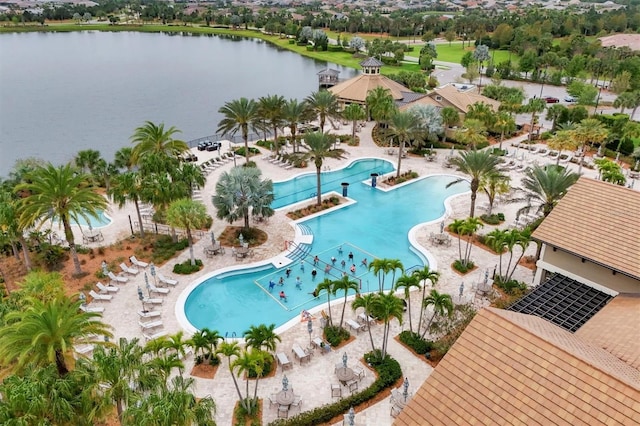 birds eye view of property with a water view