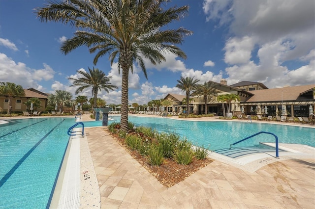 view of swimming pool with a patio area