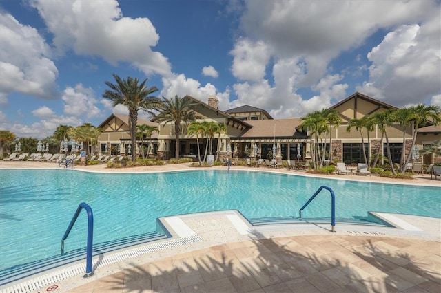 view of swimming pool featuring a patio area