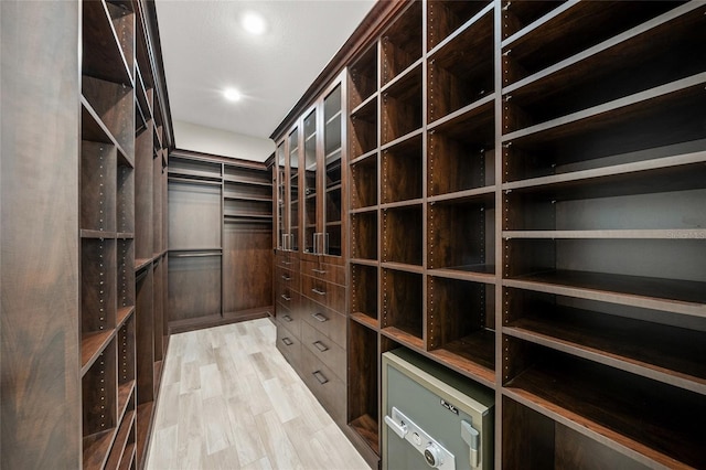 walk in closet featuring light hardwood / wood-style floors