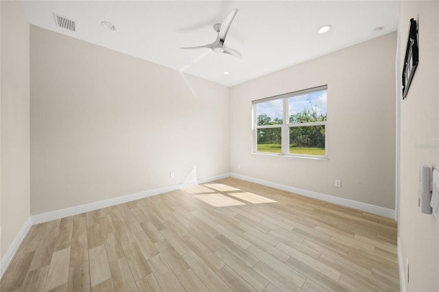 unfurnished room featuring light hardwood / wood-style flooring and ceiling fan