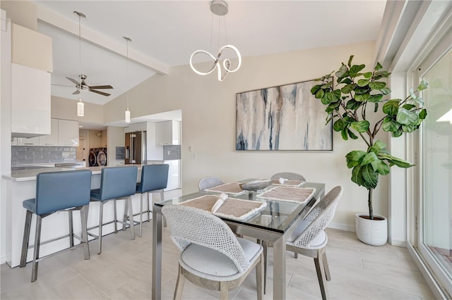 dining area featuring lofted ceiling with beams and ceiling fan