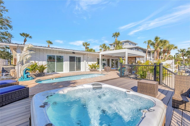 view of pool with a wooden deck