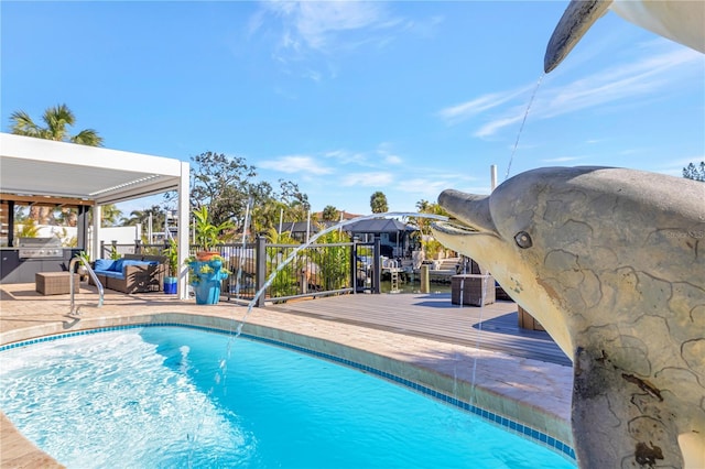 view of pool with pool water feature