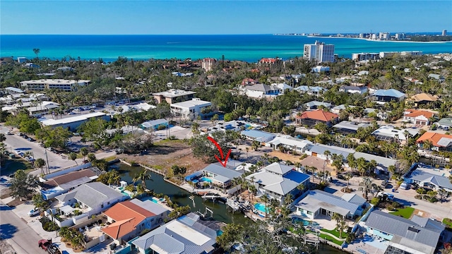 drone / aerial view featuring a water view