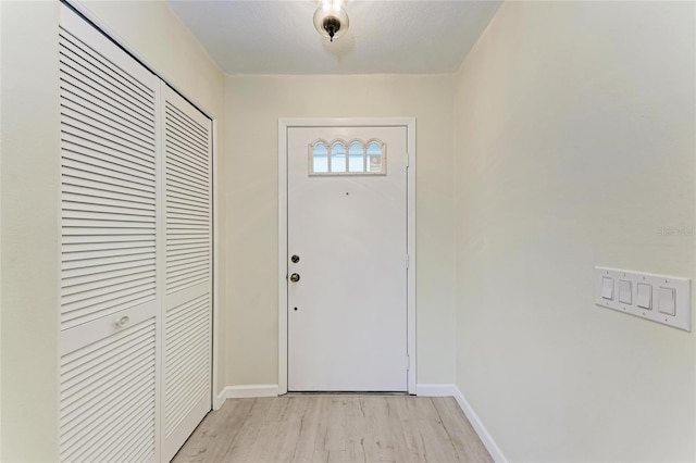 doorway with light hardwood / wood-style flooring