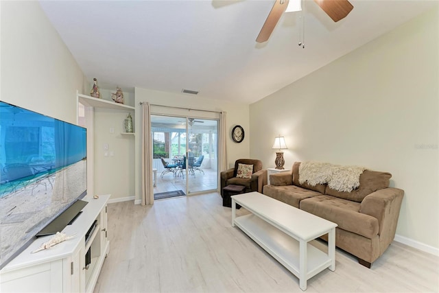 living room featuring ceiling fan and light hardwood / wood-style floors