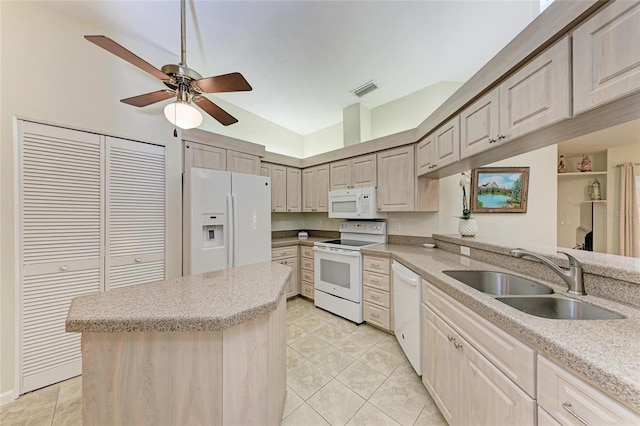 kitchen with sink, a center island, light tile patterned floors, ceiling fan, and white appliances