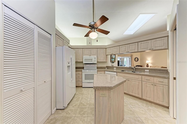 kitchen with vaulted ceiling, a kitchen island, sink, light tile patterned floors, and white appliances