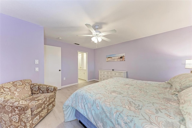 bedroom featuring ensuite bathroom and ceiling fan