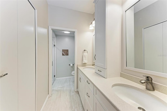 bathroom with vanity and toilet