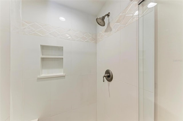 bathroom with a tile shower