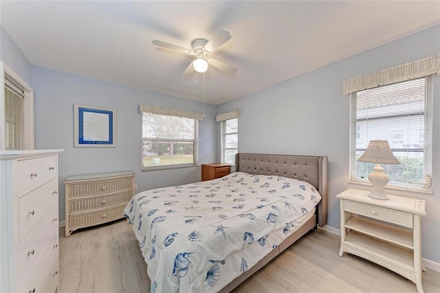 bedroom featuring ceiling fan and light hardwood / wood-style flooring