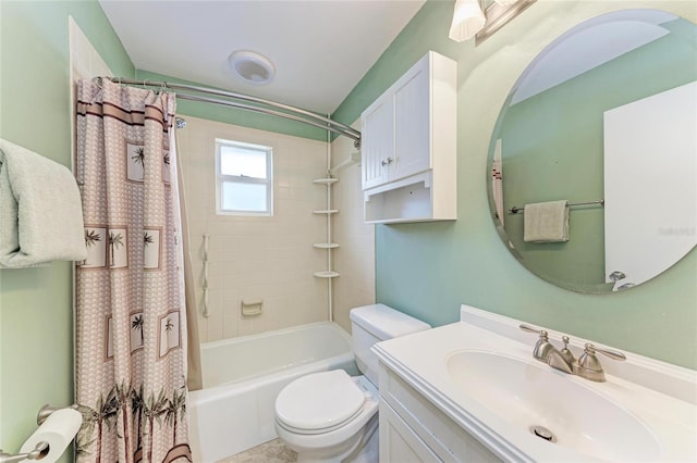 full bathroom with vanity, shower / tub combo, and toilet