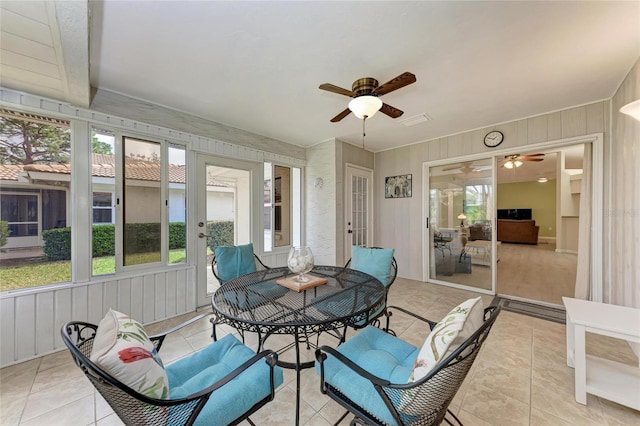 sunroom / solarium with ceiling fan