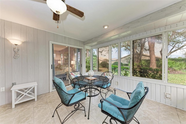 sunroom / solarium featuring ceiling fan