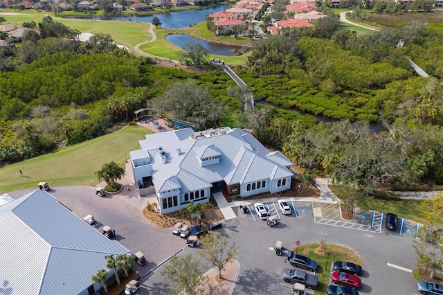 birds eye view of property with a water view