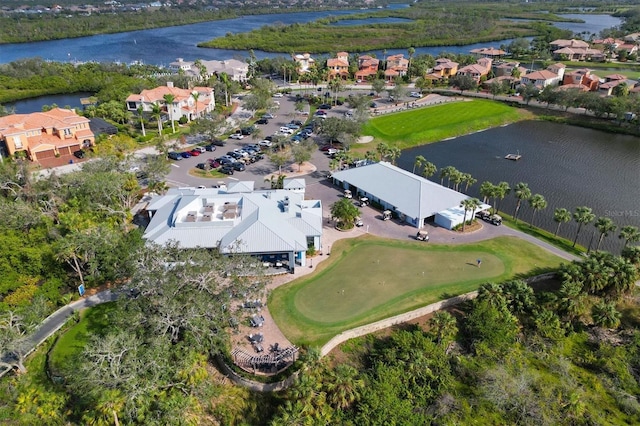 drone / aerial view featuring a residential view and a water view